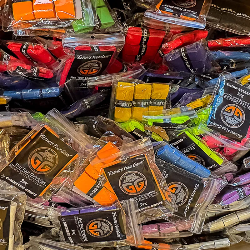 Assorted packaging of 'Pro Tour' Over grips' with visible brand logo by Grizzlee Gripz
