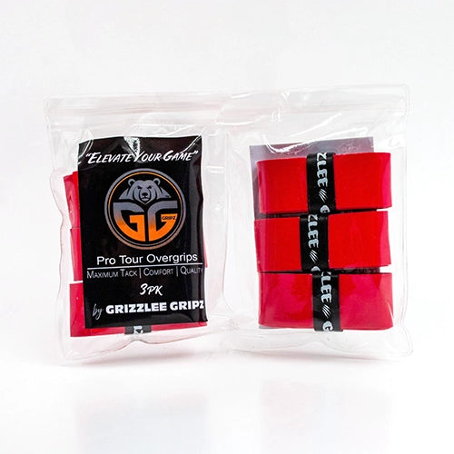 A pickleball player in action, swinging a paddle with a Red Grizzlee Gripz Overgrip, demonstrating its non-slip, tacky performance during a competitive tournament match in 2025.

 - Premium Pickleball Overgrip by Grizzlee Gripz
