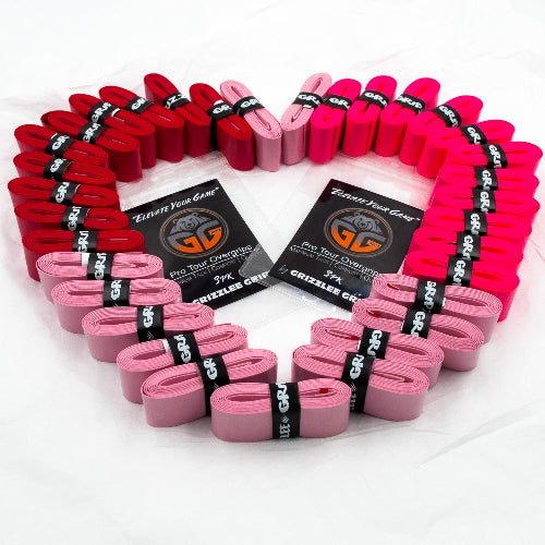 Grizzlee Gripz pickleball overgrips in red, light pink and neon pink laid out in the shape of a heart with a white background