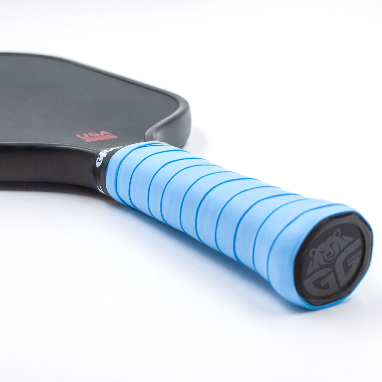 grizzlee gripz light blue overgrip wrapped around a paddle handle that laying flat on white background