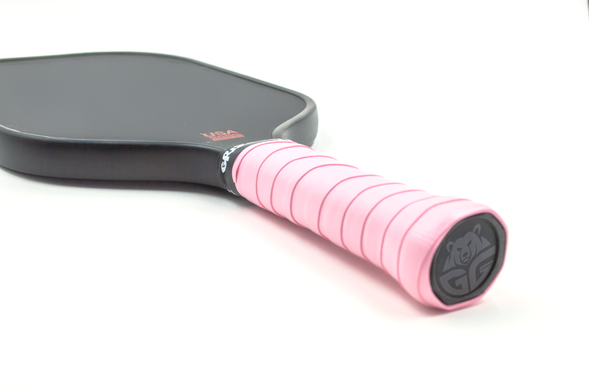 light pink gg overgrips on a paddle - Premium Pickleball Overgrip by Grizzlee Gripz