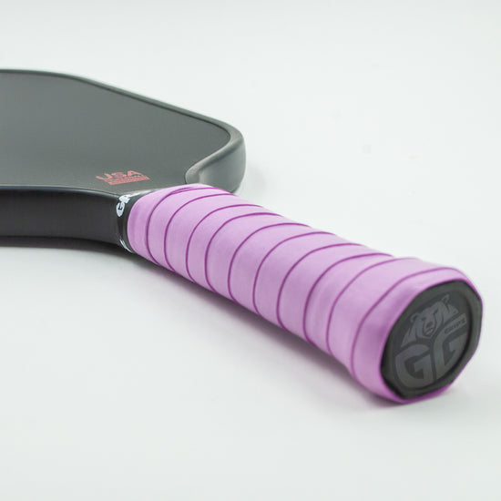 Light purple Grizzlee Gripz wrapped around a paddle handle, quality pickleball grips you can trust in performance on the court - Premium Pickleball Overgrip by Grizzlee Gripz