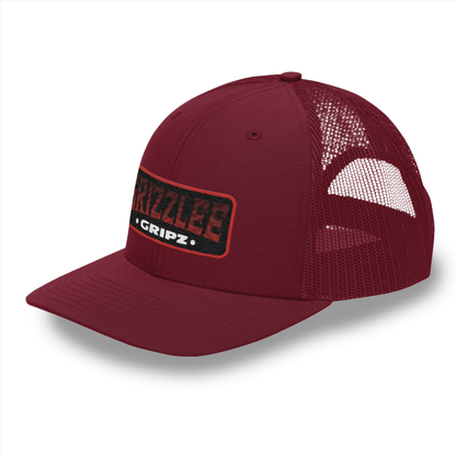 Maroon snap back trucker hat embroidered badge logo on the front