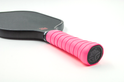 grizzlee gripz neon pink grip wrapped on a pickleball paddle laying down - Premium Pickleball Overgrip by Grizzlee Gripz