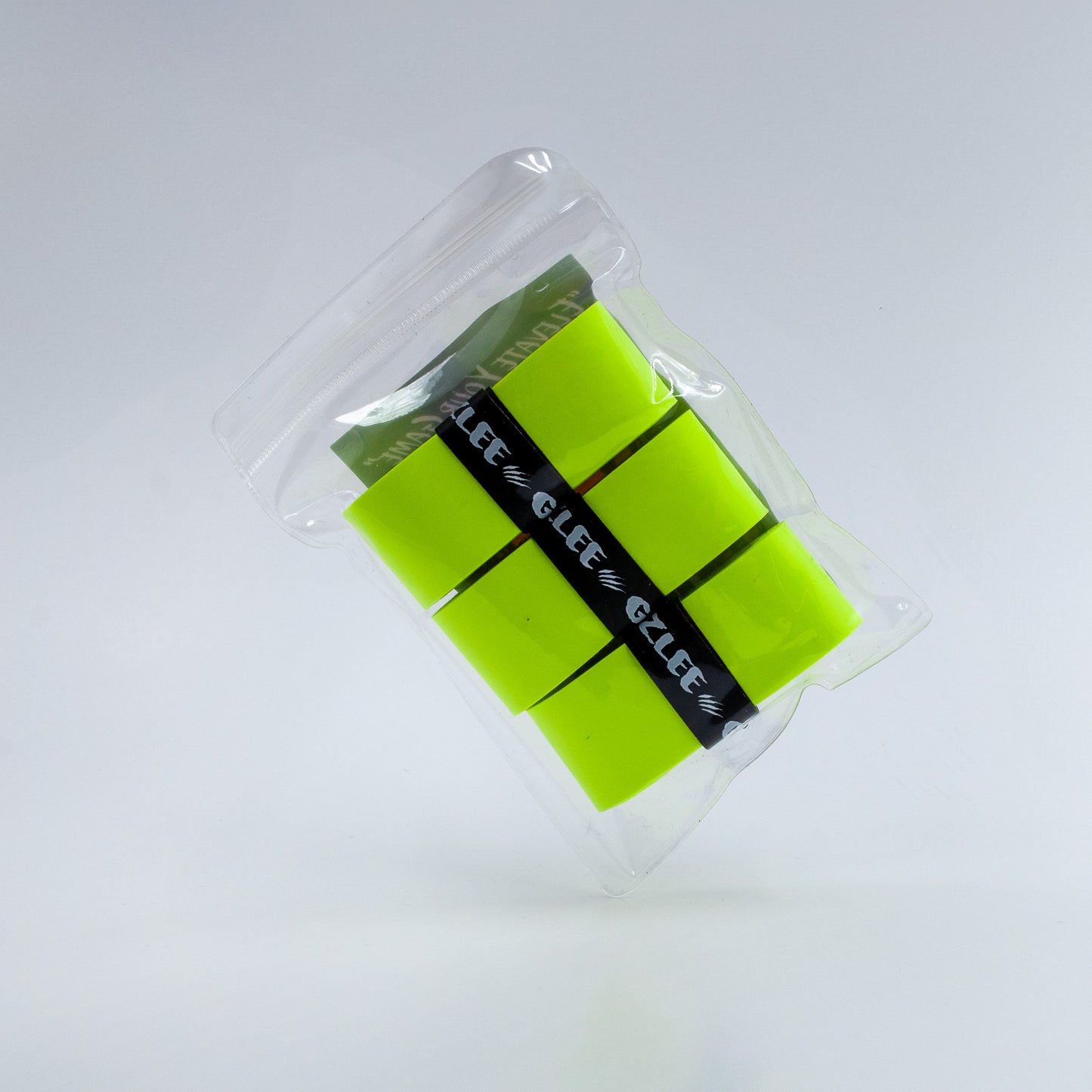 1 pack of 3 Neon Yellow by Grizzlee Gripz portrait style , tilted at an angle highlighting the 3 grips that are in a plastic bag - Premium Pickleball Overgrip by Grizzlee Gripz