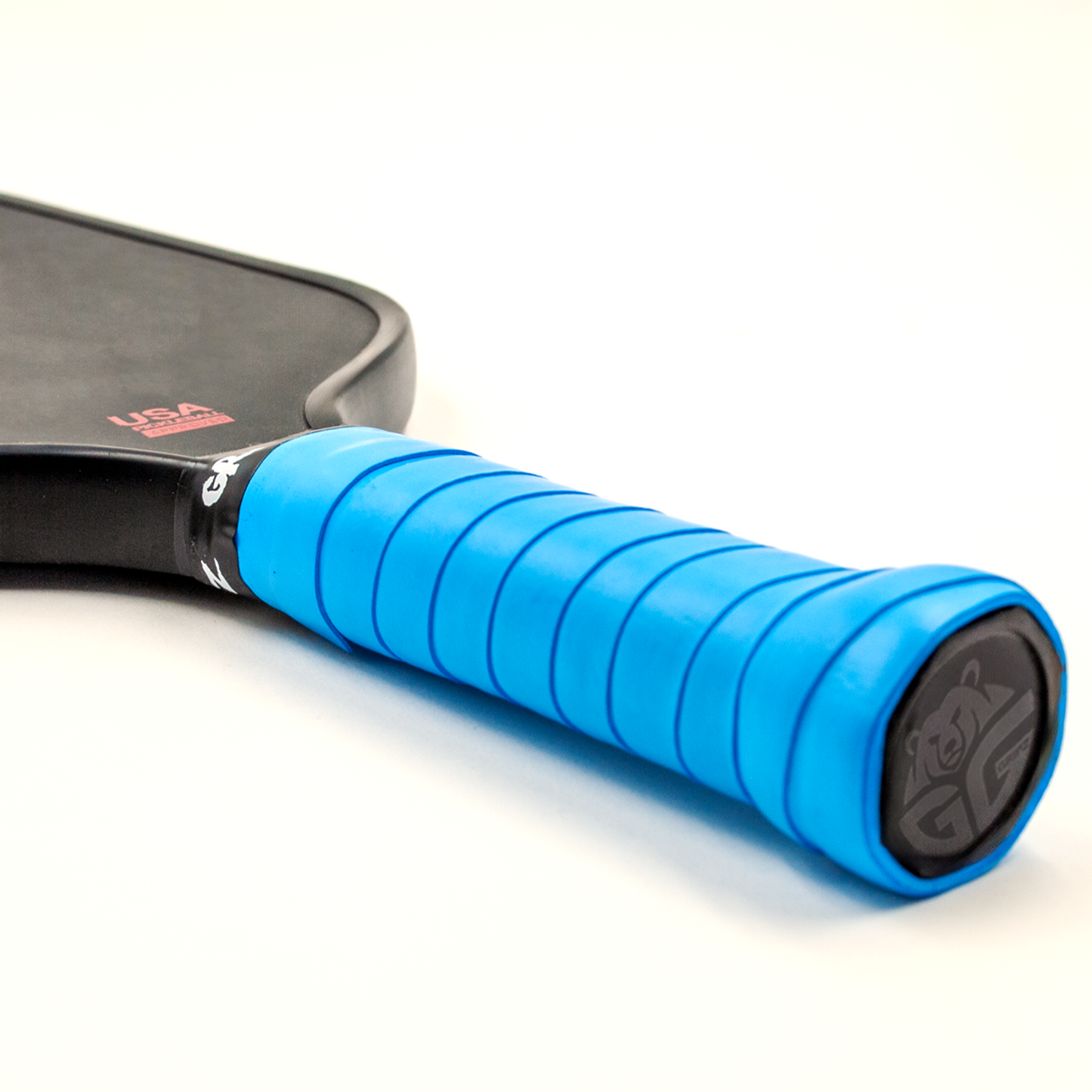 Royal blue Grizzlee gripz wrapped around a paddle handle - Premium Pickleball Overgrip by Grizzlee Gripz