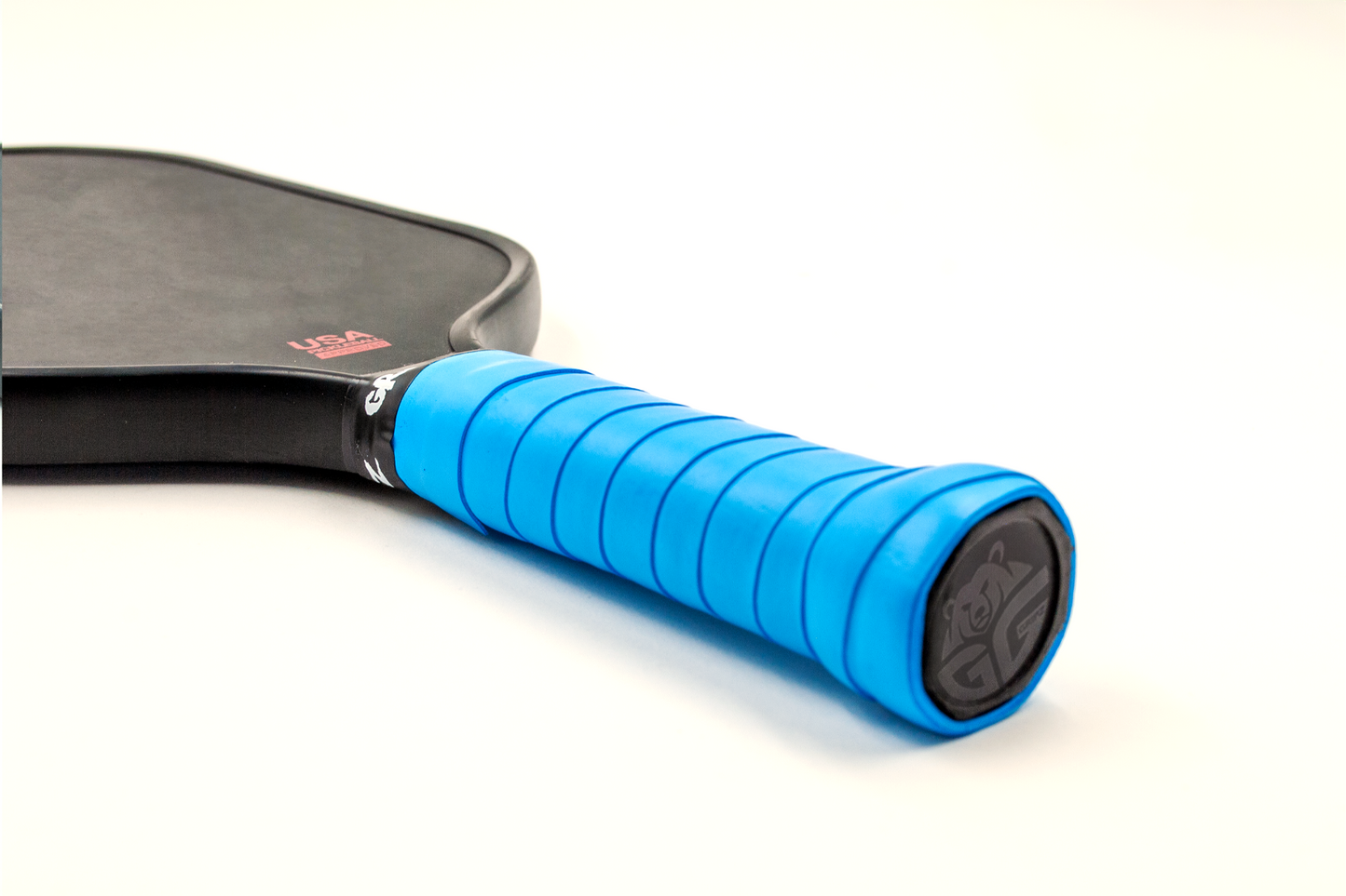 Royal Blue grizzlee gripz wrapped on a paddle handle thats laying down flat on a white background - Premium Pickleball Overgrip by Grizzlee Gripz