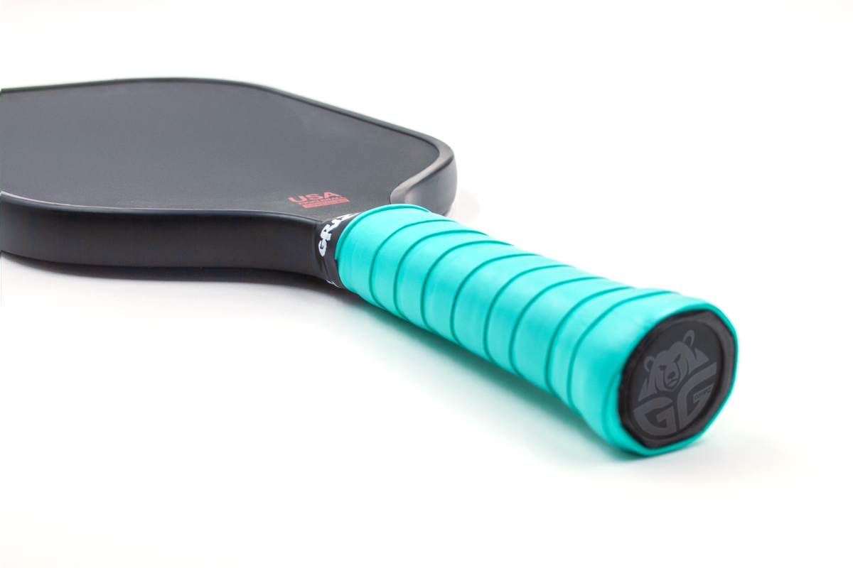 grizzlee gripz sapphire green overgrips wrapped on a paddle handle - Premium Pickleball Overgrip by Grizzlee Gripz