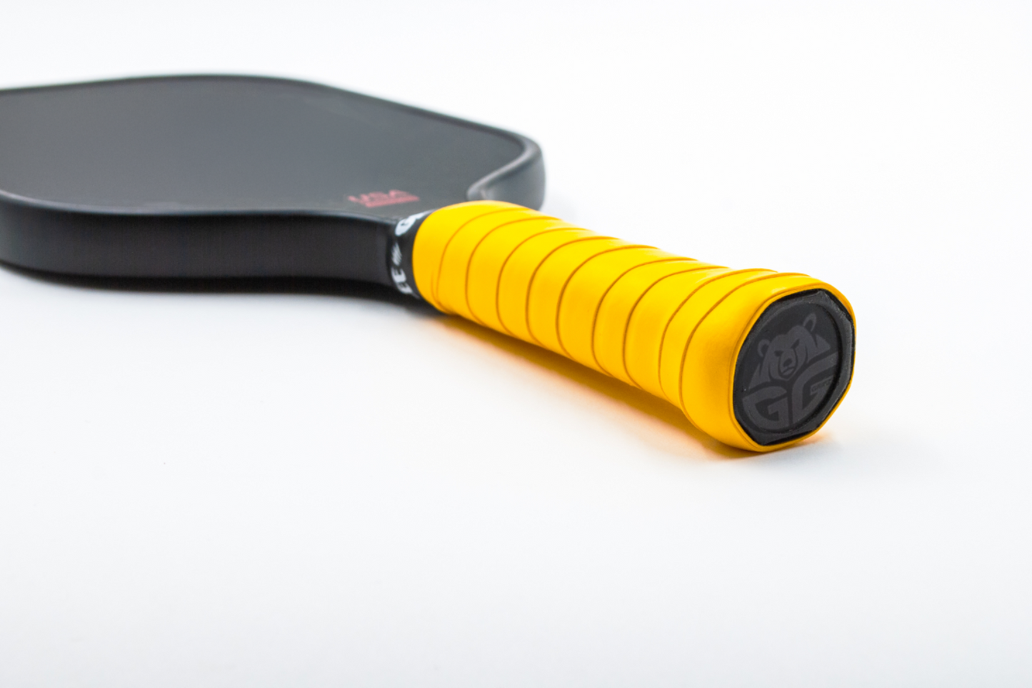 yellow grizzlee gripz overgrip wrapped on a paddle handle - Premium Pickleball Overgrip by Grizzlee Gripz