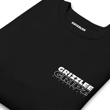 mockup of folded black crewneck with inside label in white font