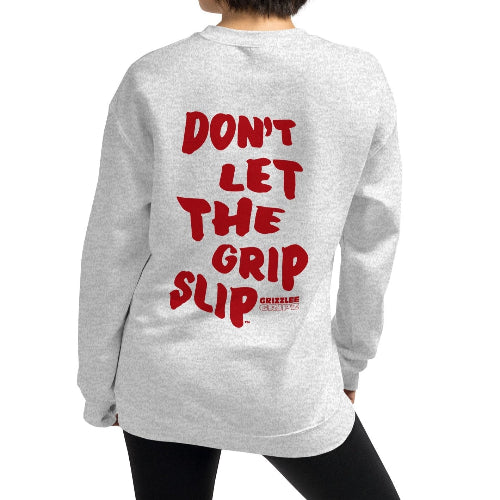 model wearing ash colored sweatshirt with slogan dont let the grip slip - Premium Pickleball Overgrip by Grizzlee Gripz