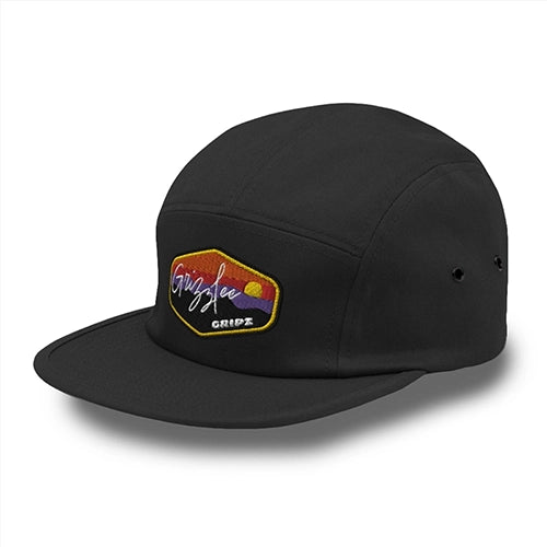 Black 5 panel hat with shadow underneath - Grizzlee Gripz Performance and premium apparel. camper style with low profile, metal eyelets, and nylon strap closure. Available in black2025