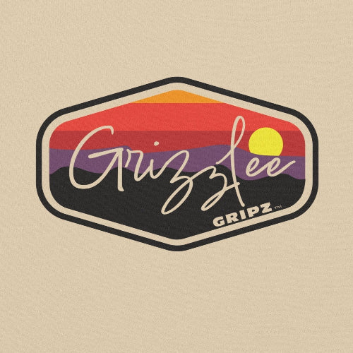 close up of sunset logo on a sand colored hoodie - Premium Pickleball Overgrip by Grizzlee Gripz