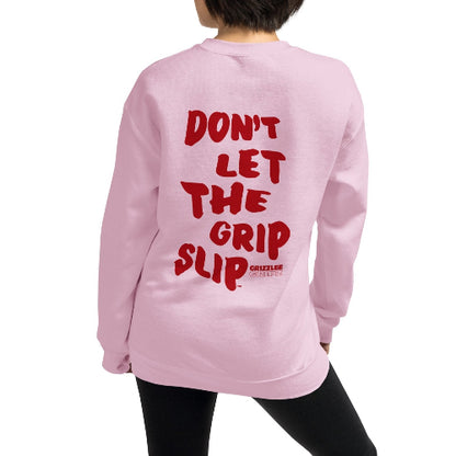 back of pink crewneck sweatshirt with red slogan dont let the grip slip